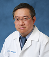 Dr. Chen smiling at camera