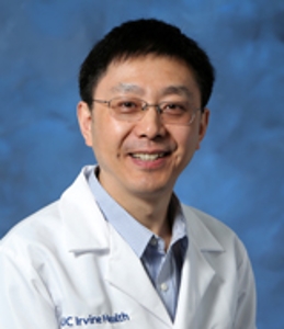 Dr. Yang smiling at camera