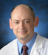 Dr. Groysman smiling at camera